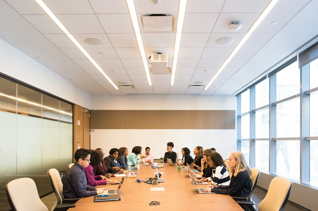 man presenting in boardroom