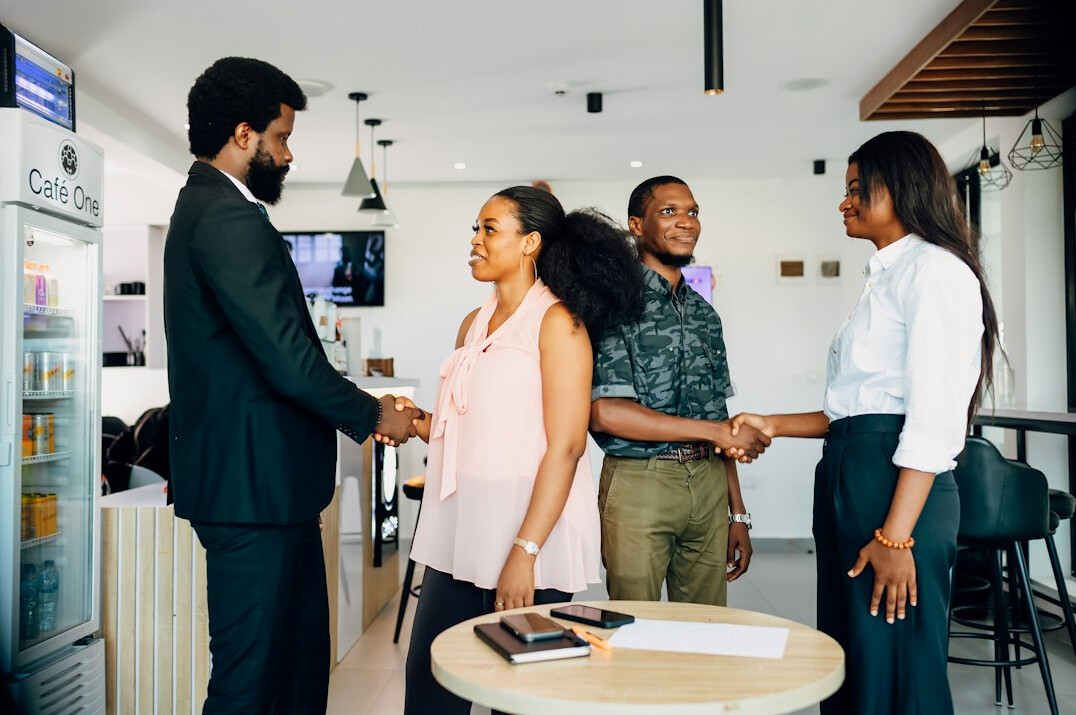 business people shaking hands in meeting
