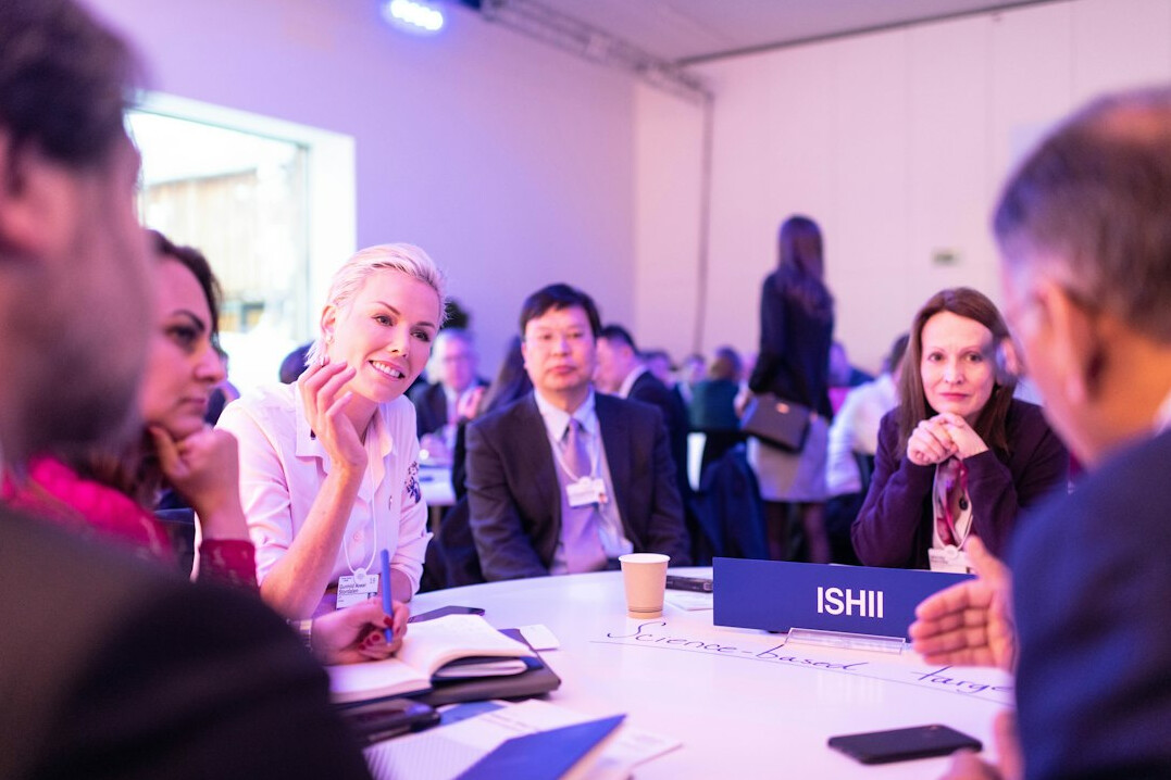 woman leading discussion at conference